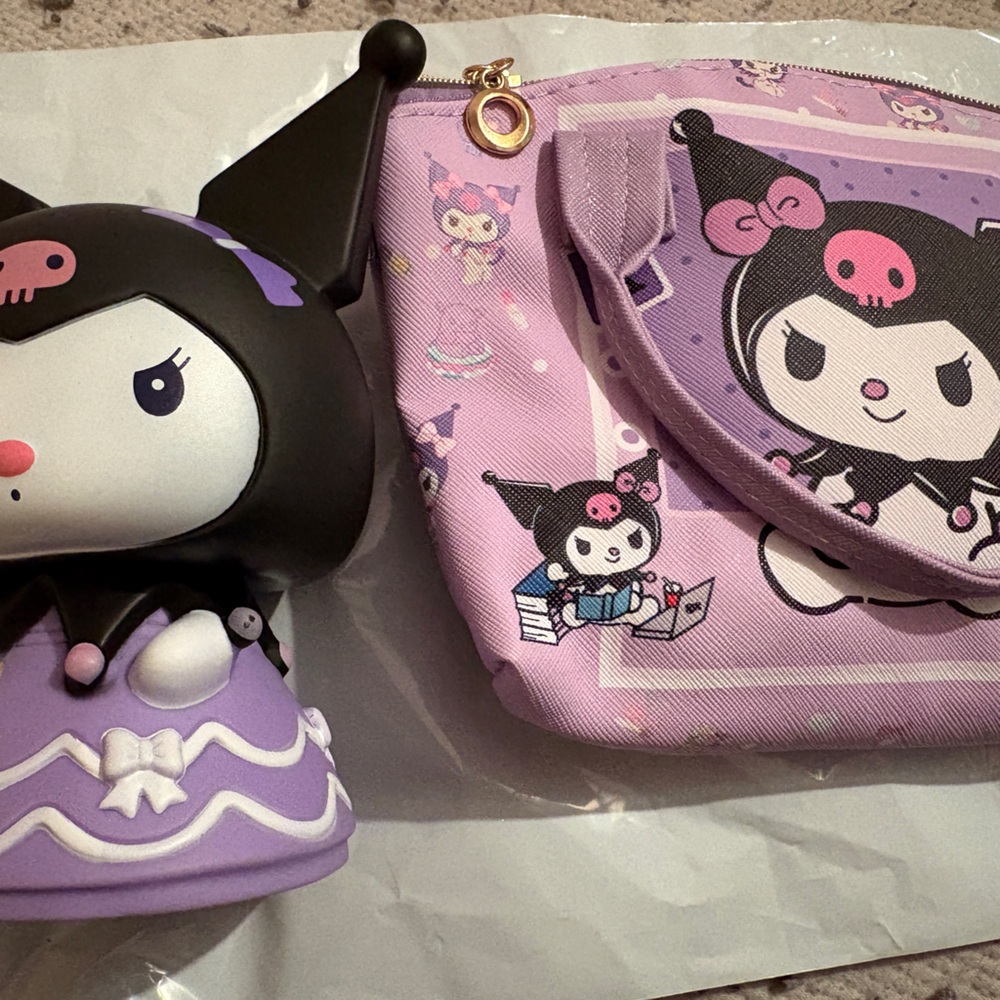 Kuromi character coin bank. And small 8 inches x 4 inches crossbody purse